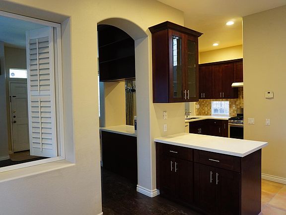 Open and bright kitchen with plenty counter top and cabinets