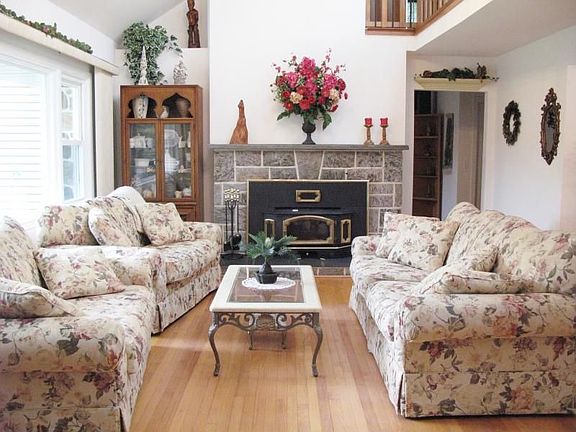 LIVING ROOM WITH STONE FIREPLACE