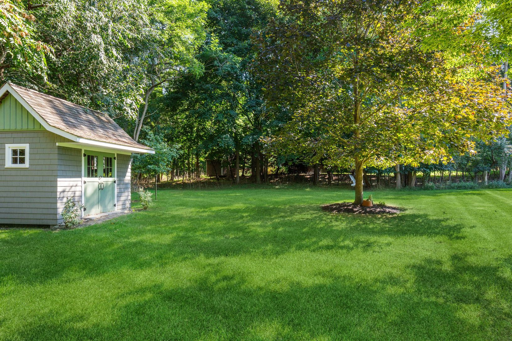  View of Yard with Detached Shed for Storage
