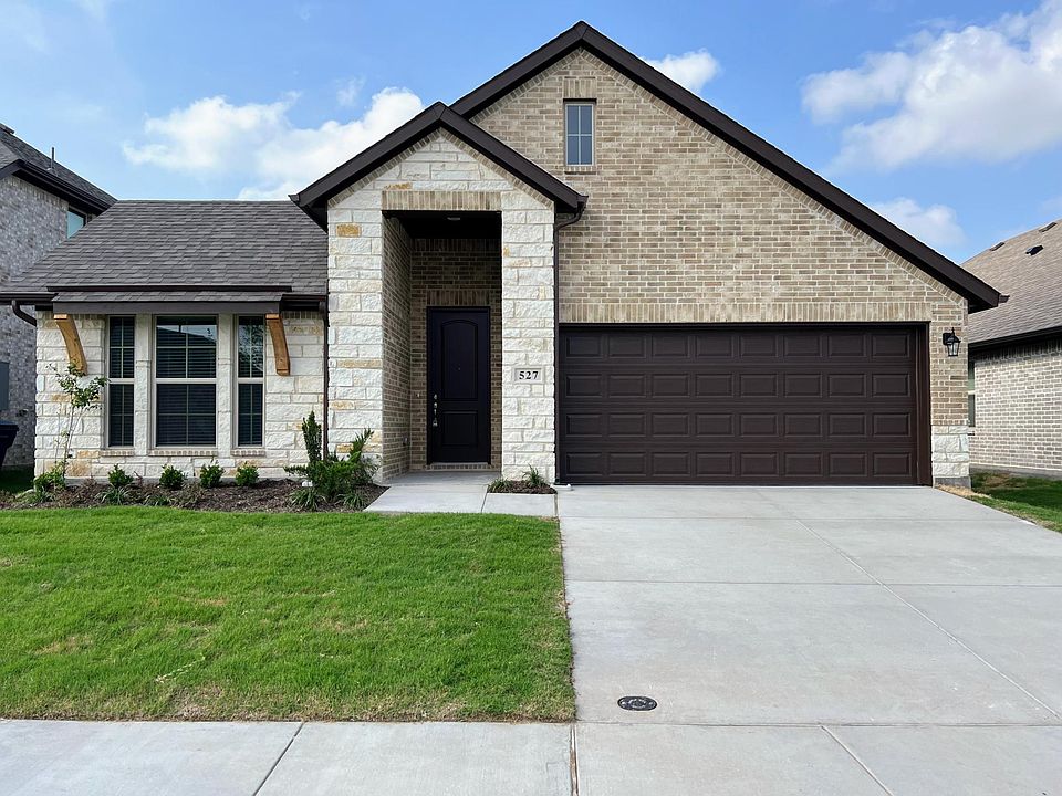 Beautiful curbside appeal with stone and brick