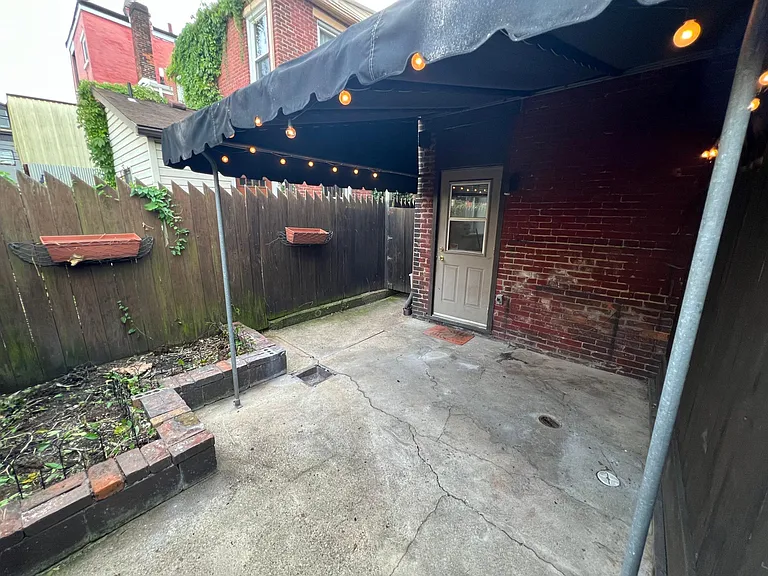 Backyard: private outdoor covered patio