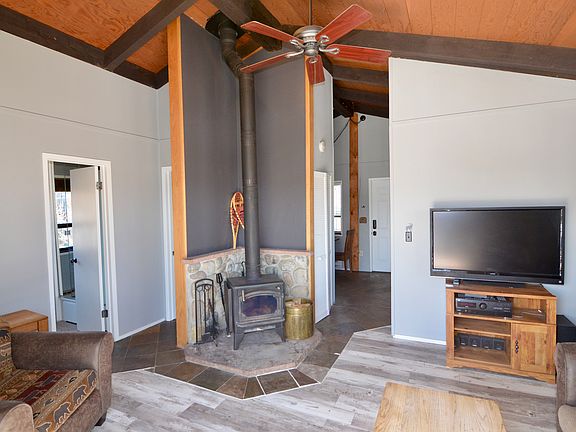 Living room with Fireplace facing inward from the patio