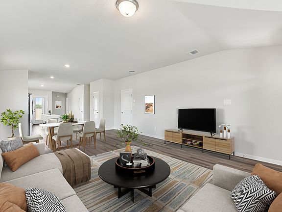 The connected kitchen, living, and dining areas are great when hosting company.