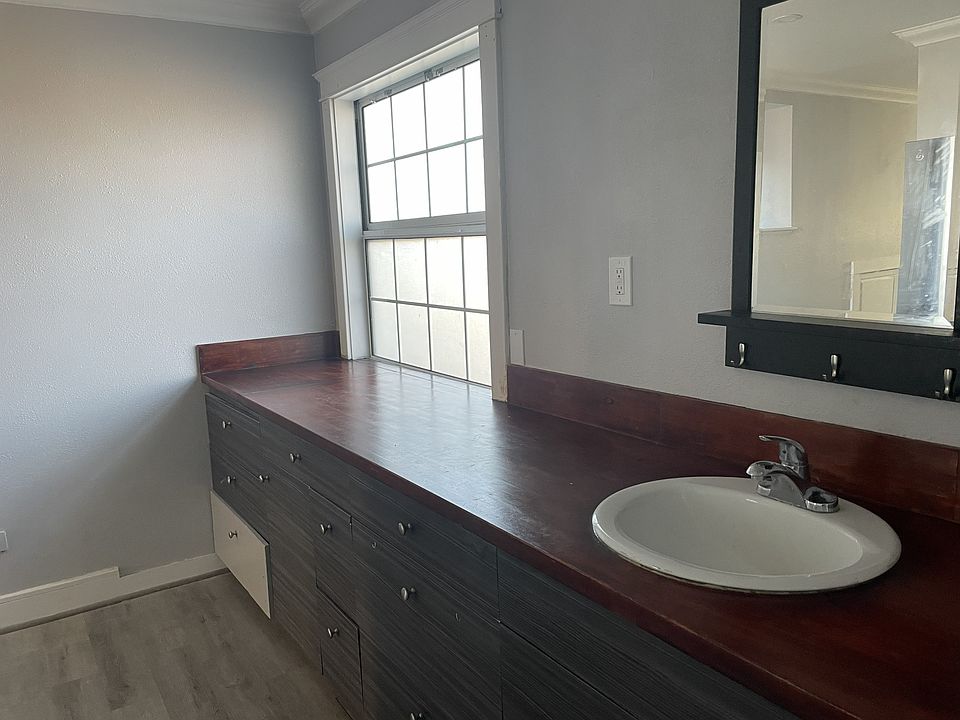 Counter for two burner hot plate. Also sink for bathroom washing hands etc.