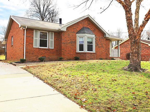 Front of house with off street driveway leading to 2 car garage. Front and back entrances.