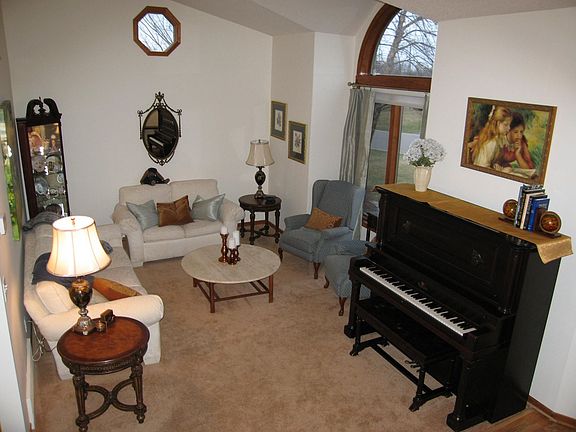 Living room with vaulted ceiling and transom window