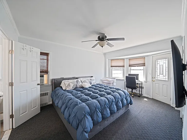 Oversized bedroom with ensuite bathroom and access to rear deck