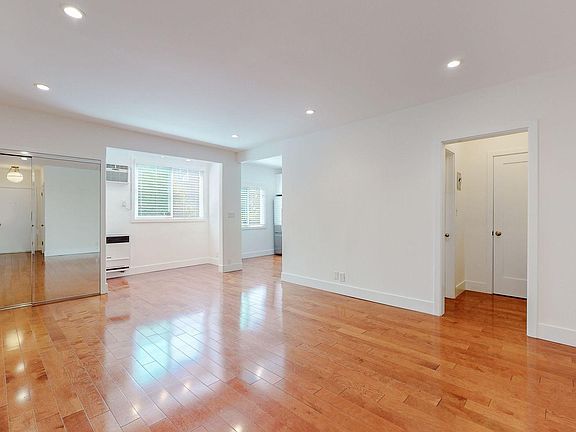 MAIN ROOM W/ MIRROR CLOSET AND DESK OR EAT IN KITCHEN NOCK AREA IN REAR