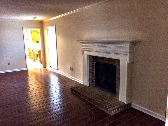 Cozy fireplace in living room with gas logs