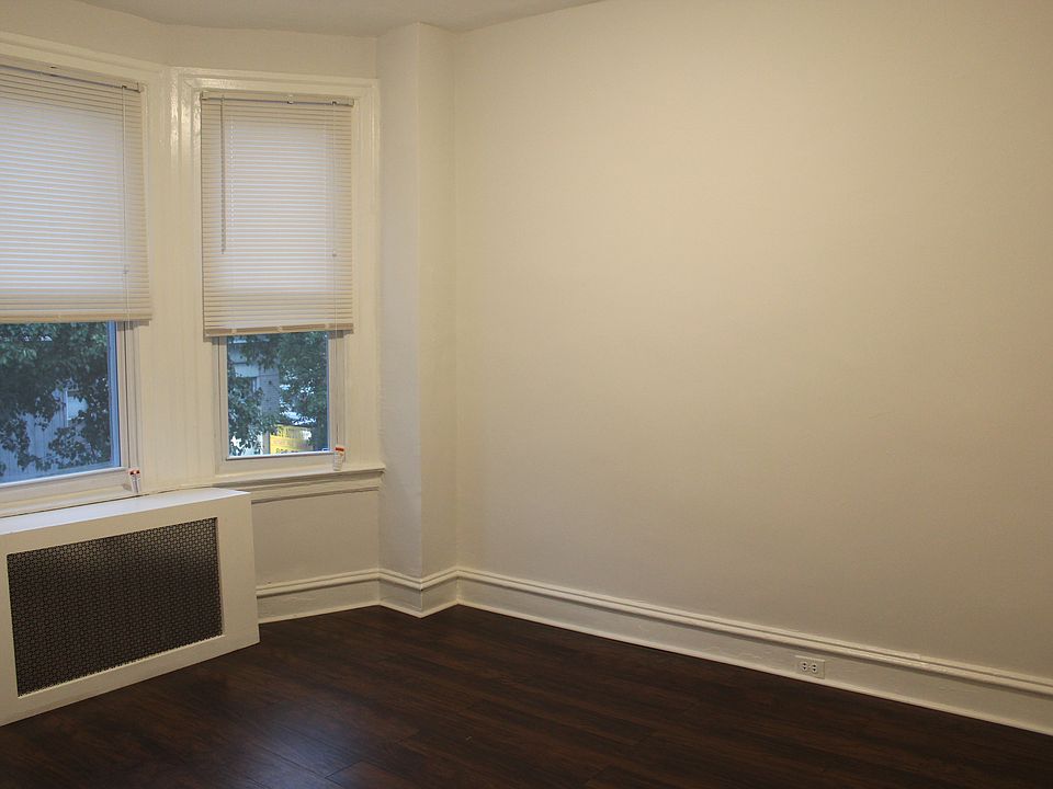 Bedroom looking over Lancaster Avenue with natural lighting