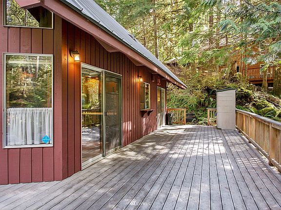 The entrance to the home is the glass door to the left of this picture