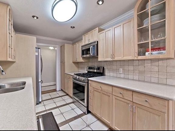 Efficient galley kitchen with great counter space and a functional layout.