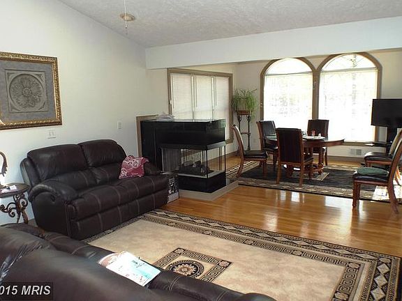 Living room with 3 sided fireplace