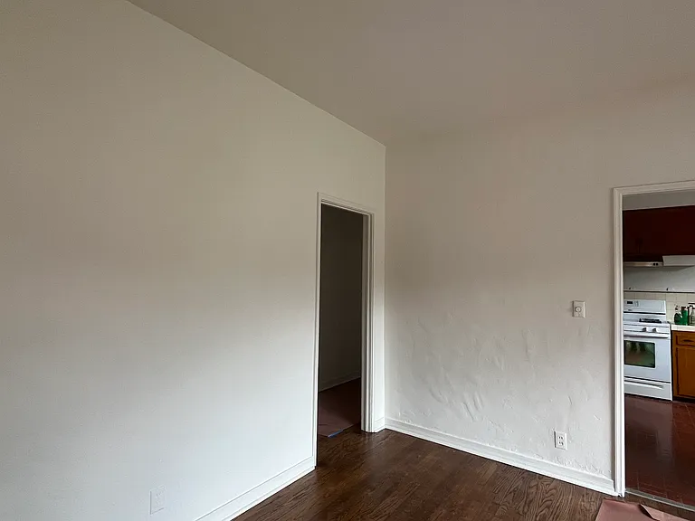 dining room looking toward kitchen and hallway on left