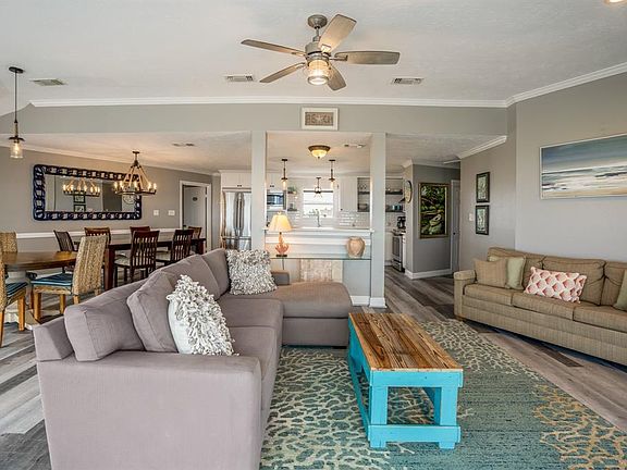 From the living room looking into the dining area as well as the breakfast room and kitchen, all extremely central.