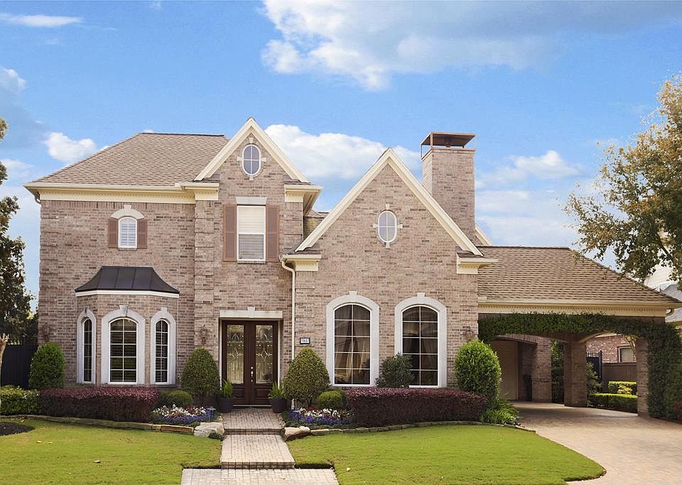 Immaculate golf course home with beautiful curb appeal, extensive landscape and great location in th
