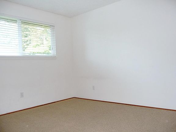 Large bedroom with big, sunny window and huge closet.