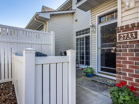 Patio area in the front with privacy fence
