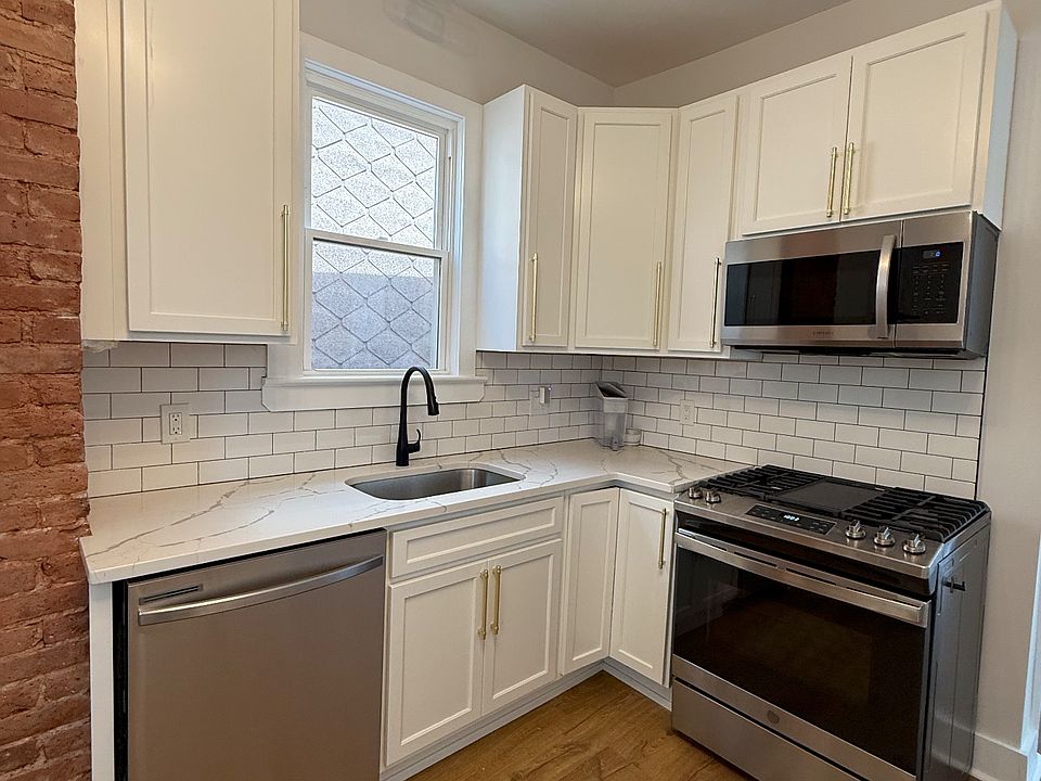 Stainless steel appliances and window over the sink