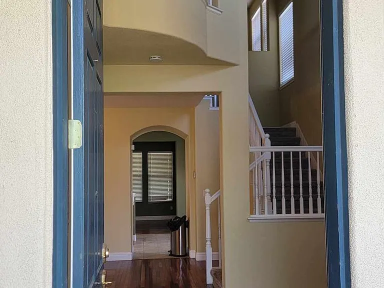Front entrance - can see all the way to back living room and upstairs vaulted ceiling
