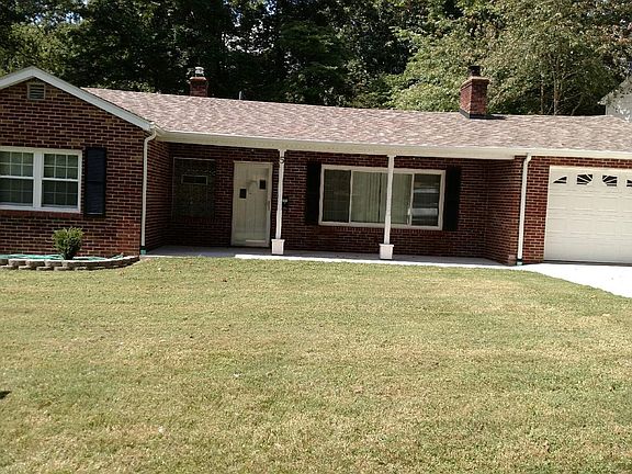 FRONT OF HOME HAS A OPEN FRONT PORCH FOR YOUR ROCKING CHAIRS