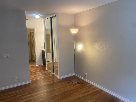 Bedroom with hall/closets and bathroom sink vanity