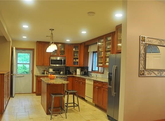 Kitchen with Granite Top and Stainless Steel Appliances