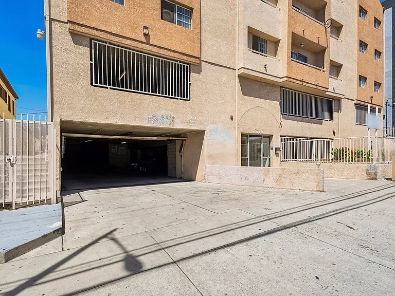 Controlled access parking garage with gated entry for added security.