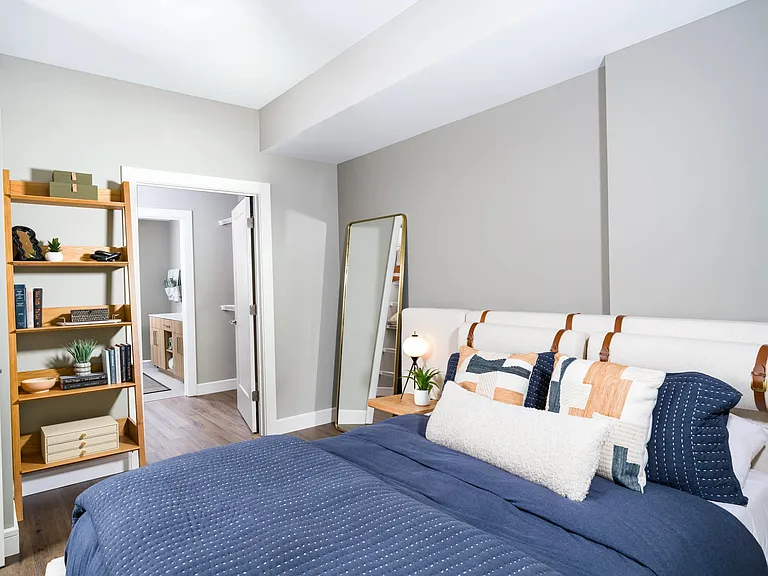 A serene primary bedroom, offering layered comfort and thoughtful design, with the rhythm of Nashville just beyond your door.