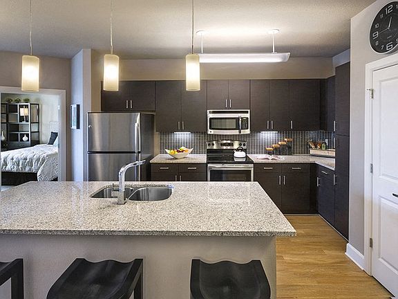 Contemporary kitchen layout is perfect for entertaining