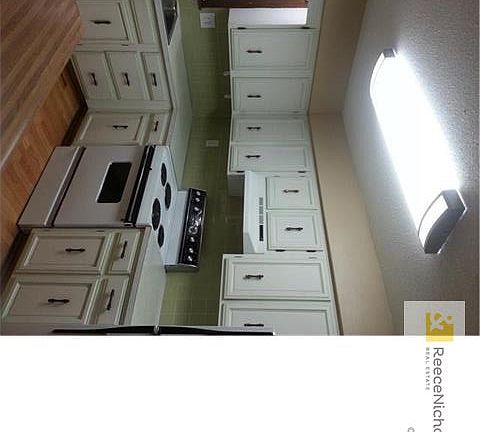 Kitchen. Stove and Refrigerator are staying.