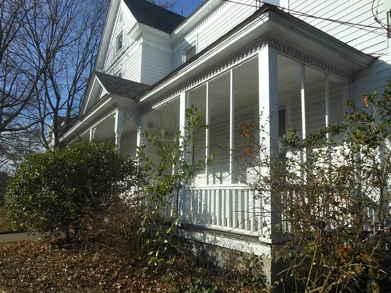 Picture of front porch. Faces south on Guilford Avenue.