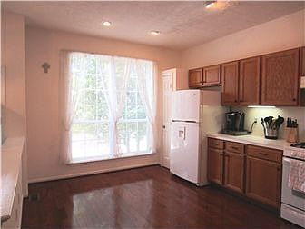 Sunny kitchen with wood floor