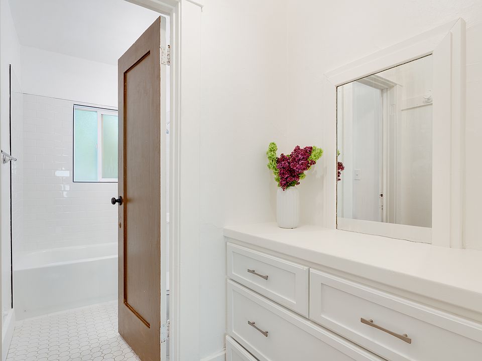 Vanity area leading into the bathroom