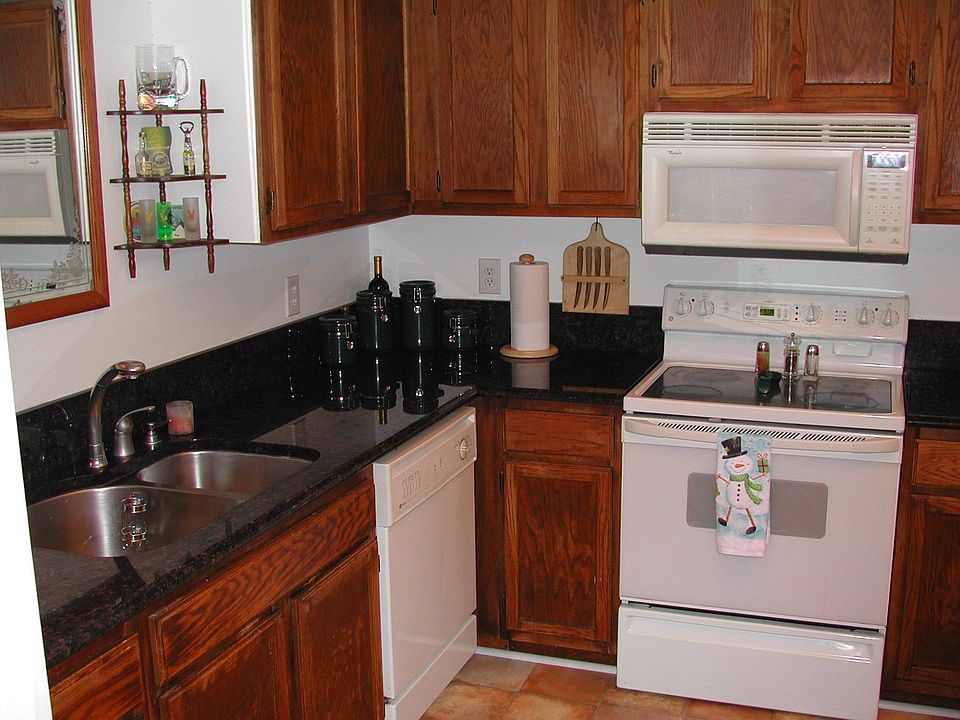 Updated Kitchen, New Granite counters, new floors, undermount sink and Delta faucet