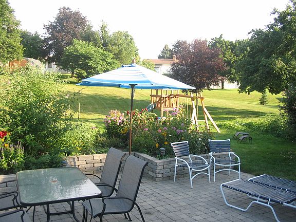 stone patio and large yard