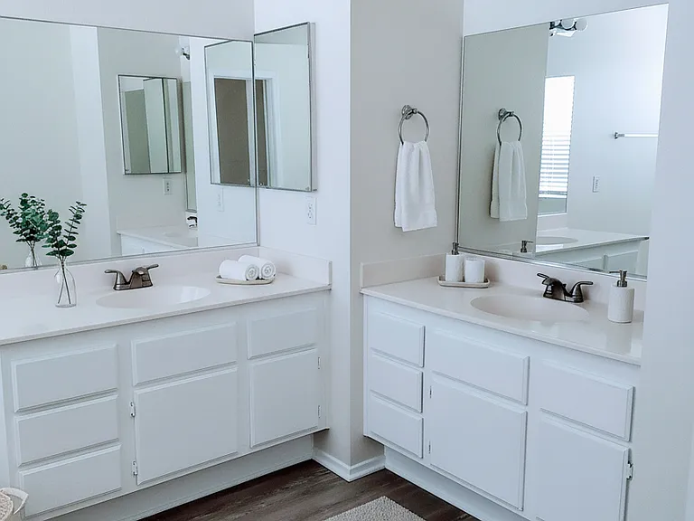 Double vanities in primary bathroom, virtually staged