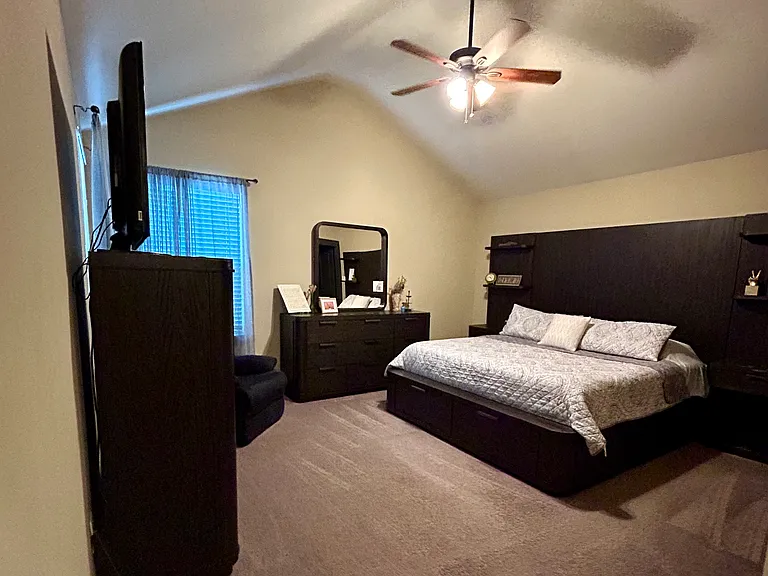 Primary suite with king size bed and walk in closet