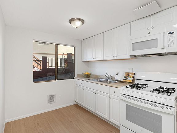 Roomy, sunny kitchen can fit a table and chairs.