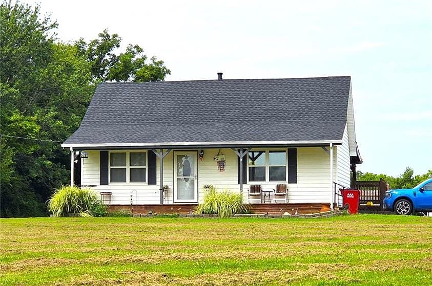 Classic vinyl siding and a neat asphalt shingle roof define this charming single-story home.