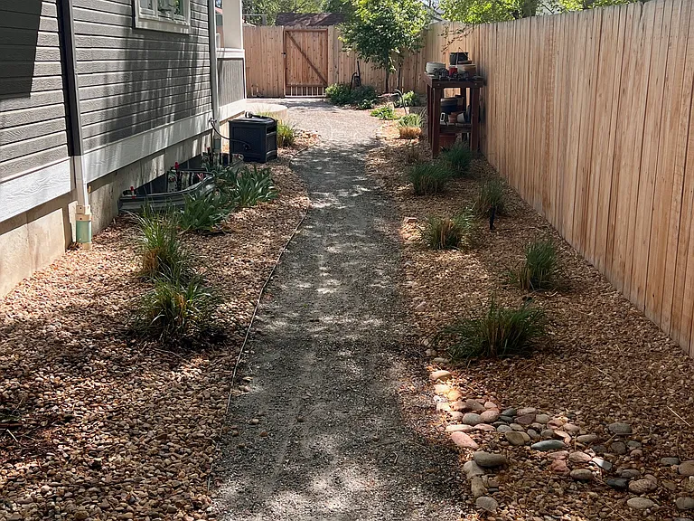 walk to back of home. nice, but not overwhelming, landscaping.