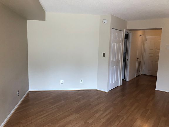 Main room with closet and front entry