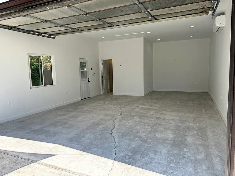 Remodeled detached garage with a large window, full bathroom, separate entrance, heating and air conditioning, dimmable recessed LED lighting, and approximately 545 square feet. Ideal for a home office, gym, creative studio, media room, playroom, etc.