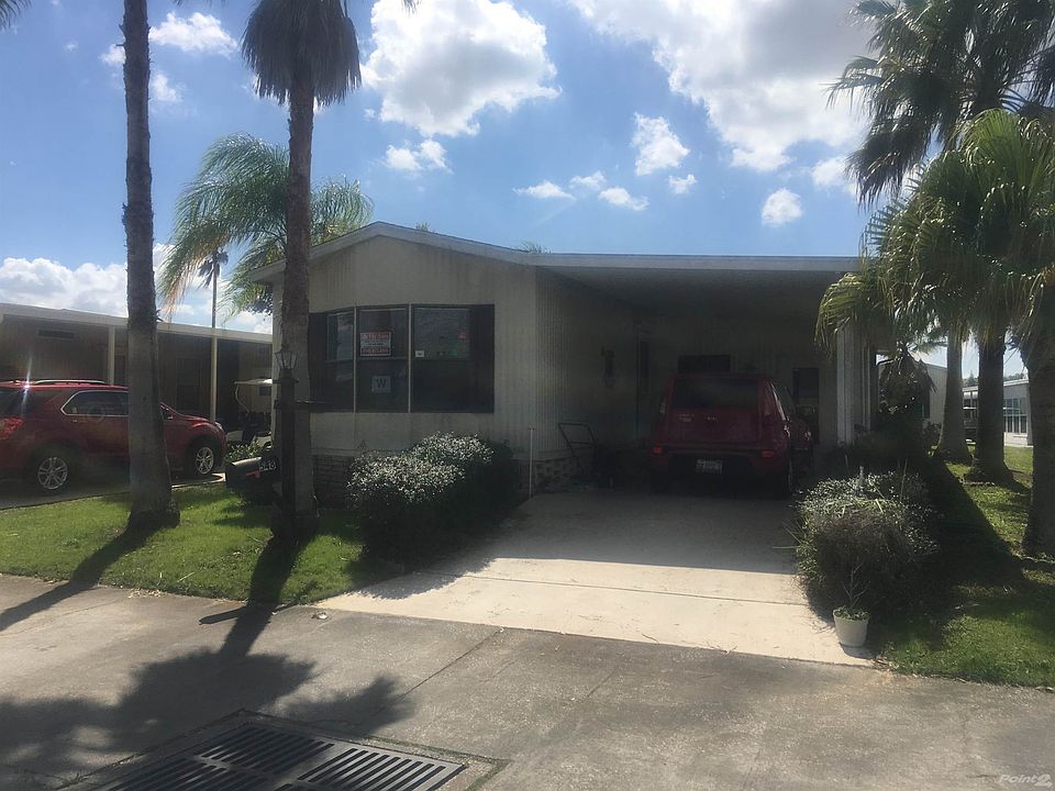 Front of Home w/ Attached Carport