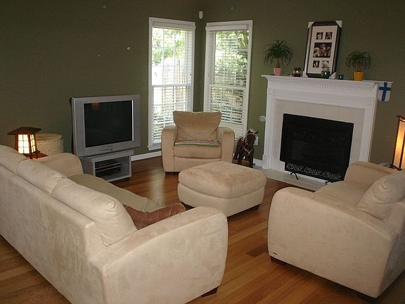 The 2 story foyer leads to this spacious family room. Hardwood floors set the 