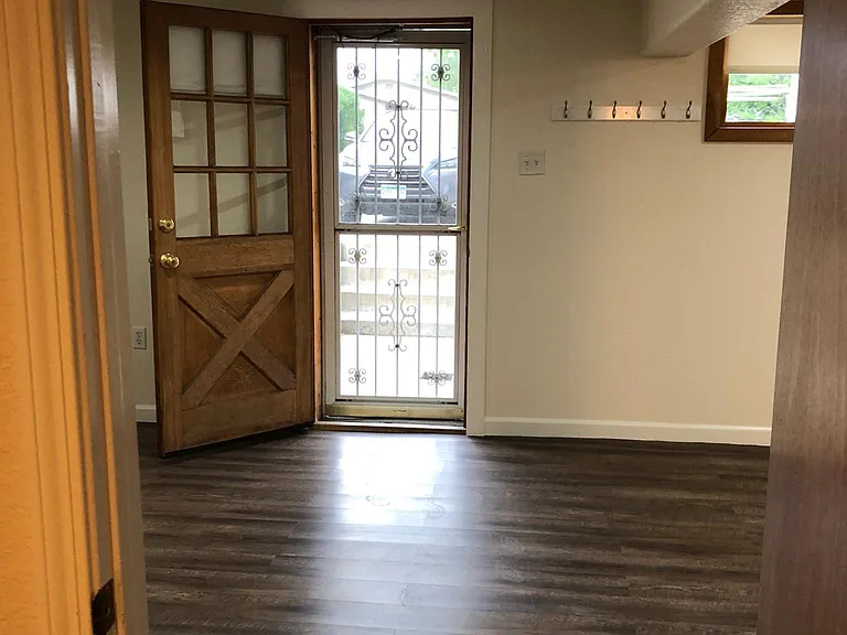 Front door view from smaller bedroom