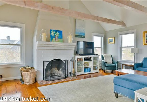 Living room with wood-burning fireplace