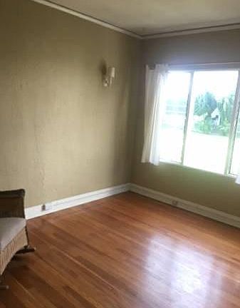 Living room with pretty courtyard views.