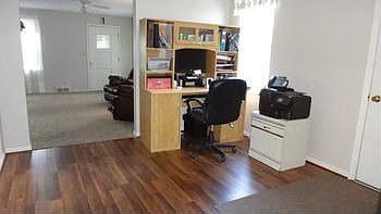 Den area separates the living room and kitchen. Unseen on the left is the doorway to laundry room.