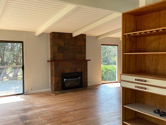 Heading into living area. Beautiful tile surrounds propane fireplace insert.
